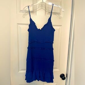 Olivaceous bright purple dress. Material is firm fitting and very stretchy.